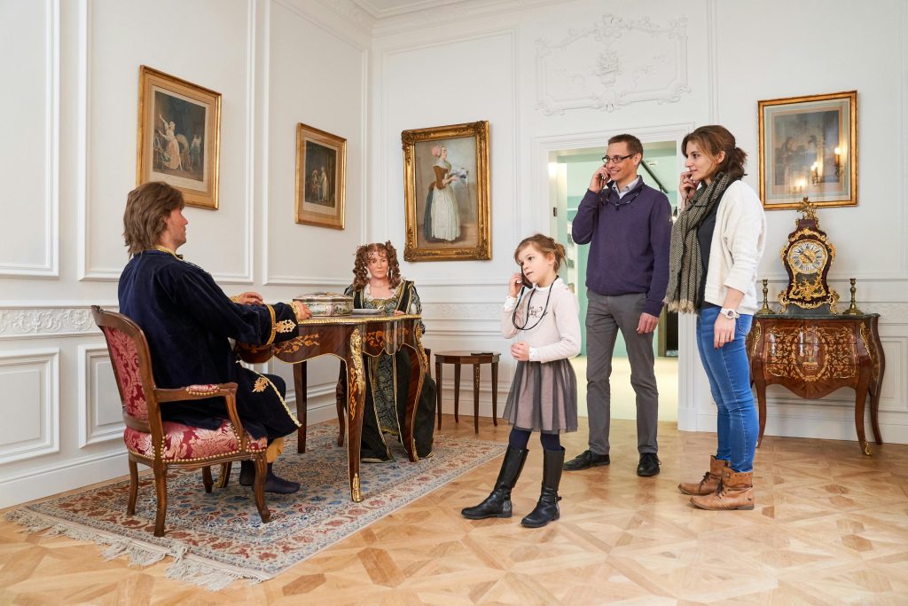 Family listening to the history of chocolate